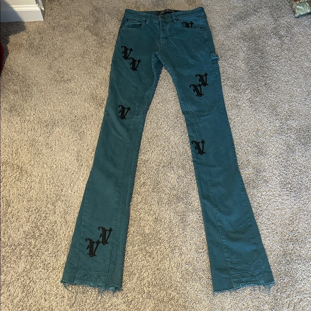 Stylish Teal Stacked Flare Jeans with Black Accents - Picture 1 of 4